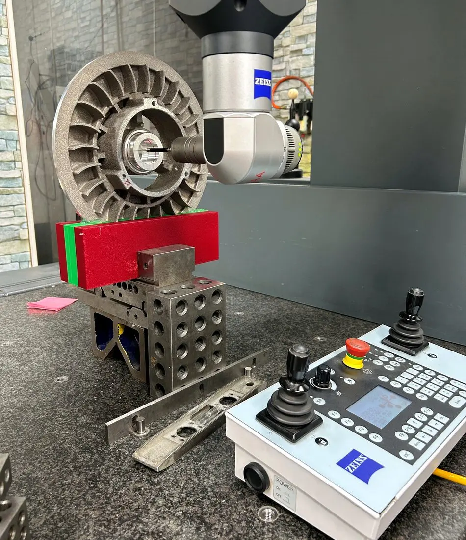 Machined casting being measured on the CMM