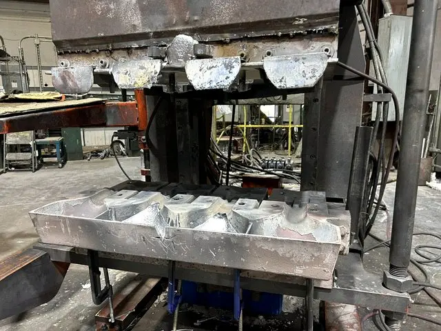 Tilt pour die opening after a shot